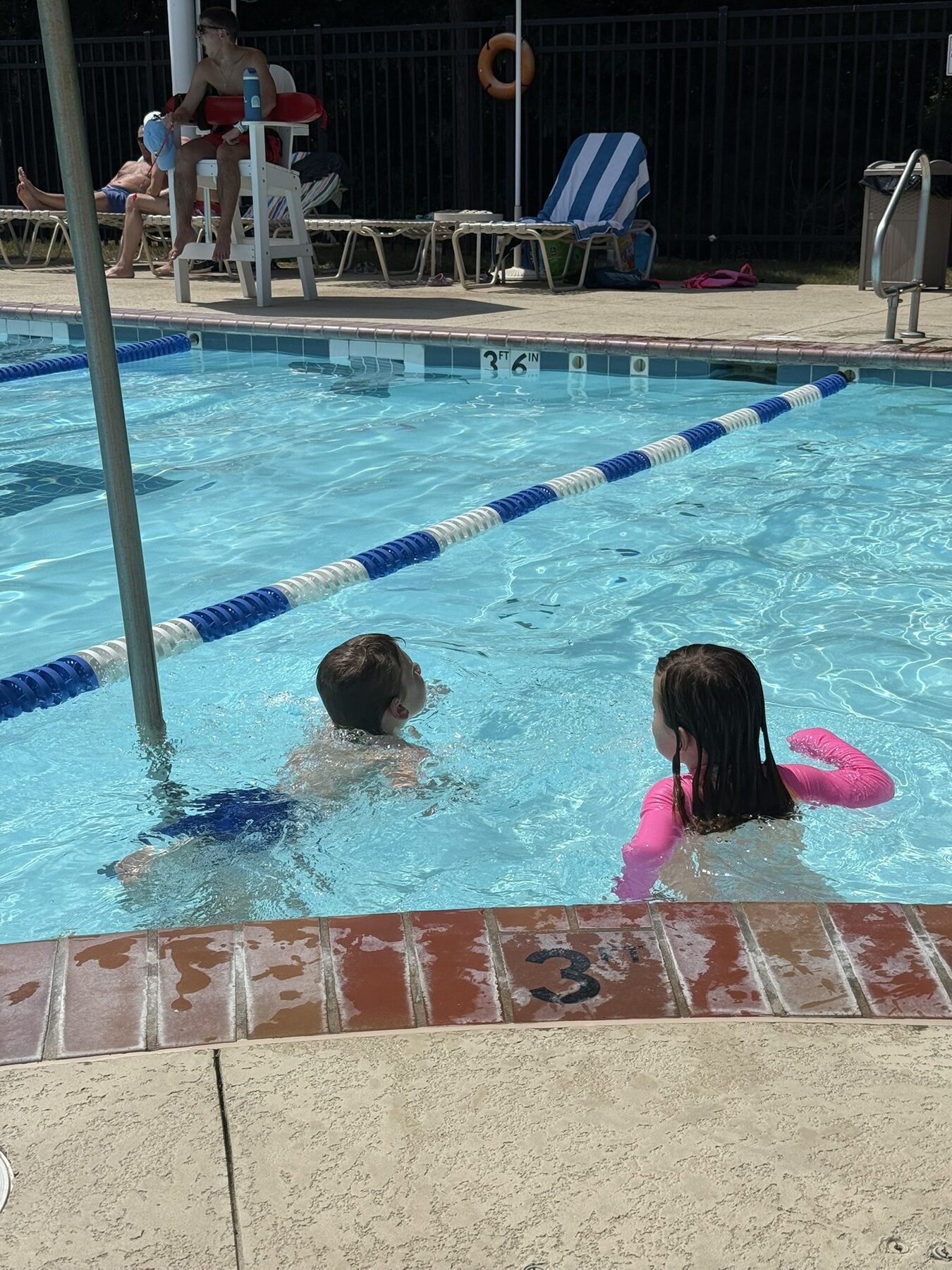 Teddy and his sister in the pool