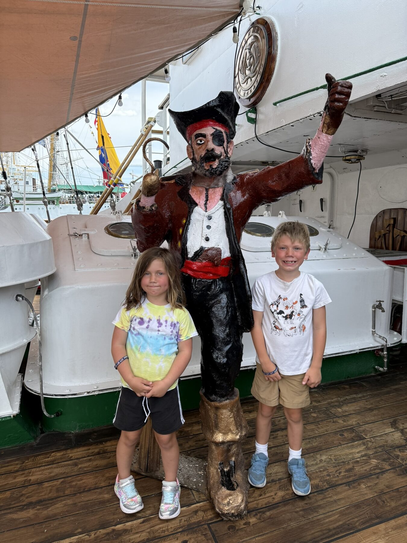 Teddy and his sister with a pirate statue