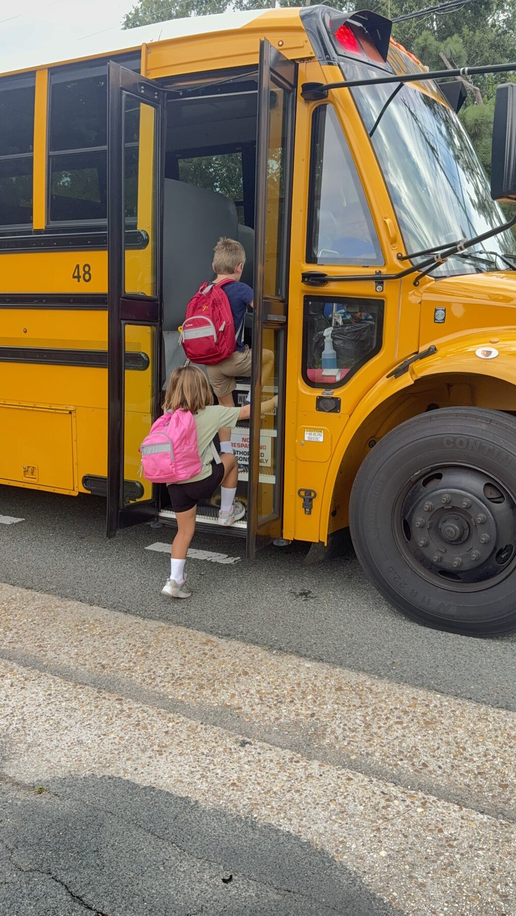 Teddy and his sister boarding the school bus