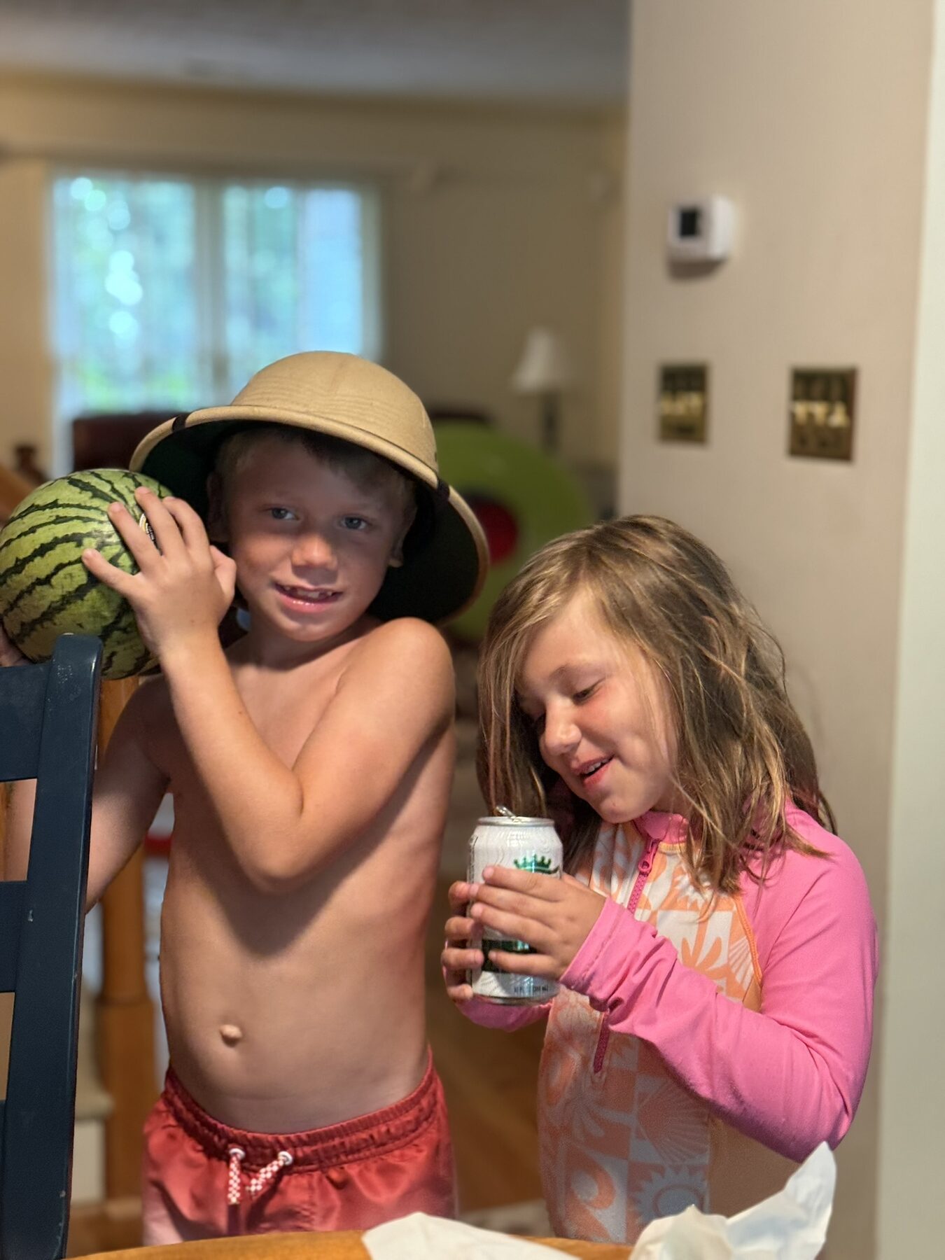 Teddy in a pith helmet with a watermelon